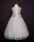Dupioni silk bodice and tulle skirt with three elegant matching flowers on the w