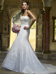 Glamorous trumpet shaped silhouette adorning pearl and sequined lace appliques. 