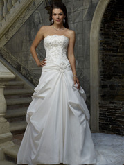 Strapless bodice crowned with a scalloped neckline is radiantly ornamented with 