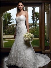 this strapless gown has a trumpet silhouette and a semi-cathedral length train.