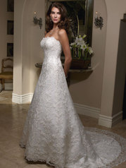 This lace gown has a scalloped neckline and fit-and-flare silhouette