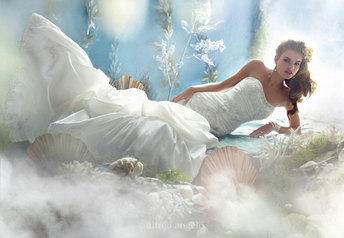 # ARIEL This romantic gown celebrates Ariel's free spirit with re-embroidered la